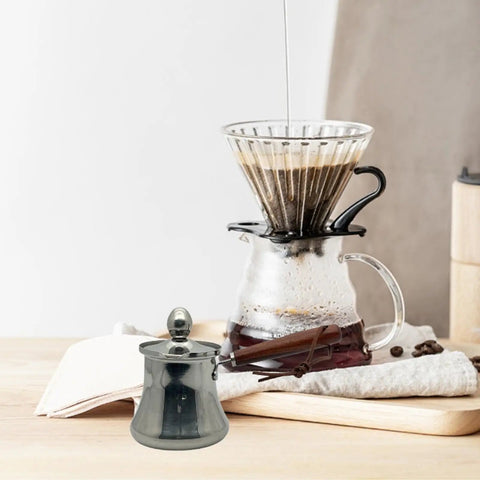 Turkish Style Stainless Steel Coffee Pot And Milk Pot With Lid Wooden Handle Spout Stovetop Butter Melting Pot 250Ml on counter