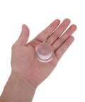 Hand holding clear 3 Pack Silicone Door Stoppers For Wall Protection With Adhesive Cylindrical Knob Shields Quiet And Durable Door Bumpers
