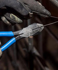 Heavy Duty Slim Head Diagonal Cutters With Spring Loaded Action For Cutting ACSR Nails Screws And Soft Rebar Tie Wire Induction Hardened Blades For Longevity Forged In USA Ironworker Pliers From Klein Tools held by gloved hand cutting wire in construction setting
