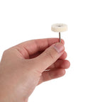Whip Your Stainless Steel Kitchen Sink Or Metal Hardware Into Shape With This Hella Flexible Mini Polishing Brush Set showing a hand holding a round mini polish brush.