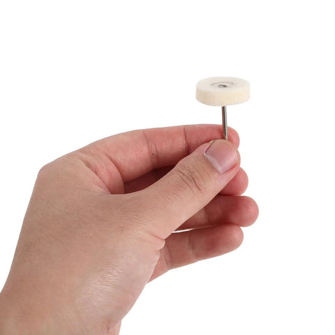Whip Your Stainless Steel Kitchen Sink Or Metal Hardware Into Shape With This Hella Flexible Mini Polishing Brush Set showing a hand holding a round mini polish brush.