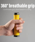 Hand holding Yellow MTB Grips For Mountain Bikes And BMX With Double Aluminum Lock Ring Grippy TPR Rubber Sweat Absorbing