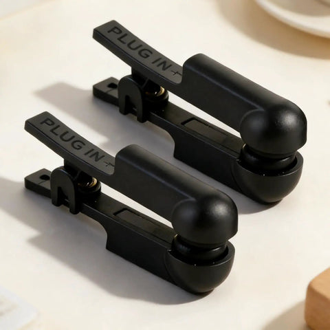 One Pair Black Rubber Ear Clip Electrode For TENS 7000 And Most Standard Units close-up view on a beige background