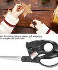 Laser-guided sewing scissors with ergonomic black handles and stainless steel blades for fabric, paper, gift wrapping.
