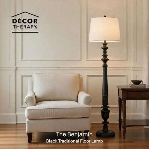 Benjamin Traditional Floor Lamp Satin Black Finish With Resin Construction next to a beige armchair and side table in living room.
