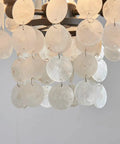Close-up of Capiz Shell Semi Flush Mount Ceiling Light in Matte Black for Bedroom and Kitchen, showcasing shimmering capiz shells.