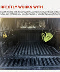 Badass Heavy Duty Tacoma Bed Channel Stiffener And Rear Support Bracket For 2005 To 2022 Toyota Pickup seen in truck bed with yellow bag.
