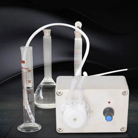 Peristaltic Liquid Dosing Pump For Lab And Aquarium Use 110 To 240 Volts, with tubing connected to laboratory glassware