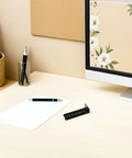 Rock Solid Under Desk Keyboard Drawer Slide Bracket featuring legit secure fit, black steel, on a desk with stationery.
