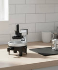 Premium Espresso Coffee Distributor And Tamper Leveler With Adjustable Rotary Depth And Twelve Prongs on kitchen counter