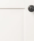 Heavy Duty Solid Metal Core Cabinet Knobs 10 Pack Black Iron One And One Quarter Inch Hardware on a white cabinet door
