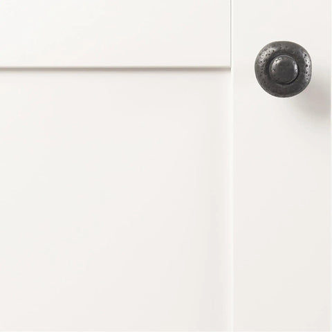 Heavy Duty Solid Metal Core Cabinet Knobs 10 Pack Black Iron One And One Quarter Inch Hardware on a white cabinet door