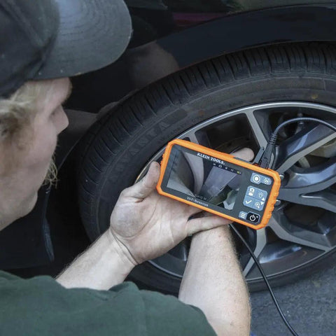Person using WiFi Pro Borescope With Dual Lens 5.5 mm 9.8 Foot Armored Waterproof Gooseneck Endoscope for tire inspection