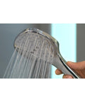 Raindance Select 120 Handheld Showerhead With 3 Spray Modes And 2.5 GPM Water Flow Chrome Finish in use showing water flow