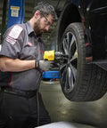 Technician using Precision Crafted Half Inch Drive Pneumatic Impact Wrench Producing Six Hundred Twenty Five Foot Pounds Of Torque At Ten Thousand Rpm.