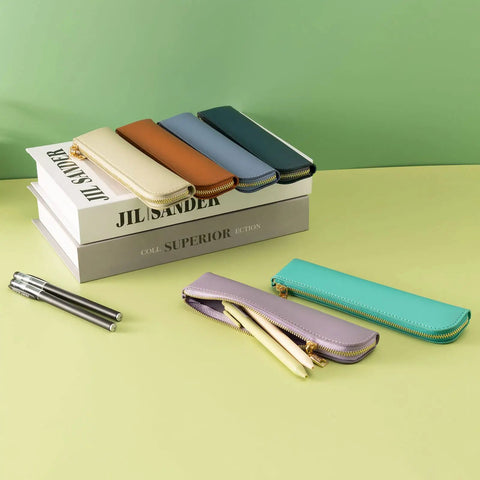 Purple Leather Pencil Case For Adults Slim Soft Pen Bag With Zipper Minimalist Pencil Pouch on table with pens