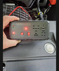 12V Automotive Relay Tester Kit With Battery And Alternator Check, Tests 4 And 5 Pin Relays held by a hand during car inspection