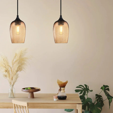 Modern dining room with Dope Two Pack One Light Pendant Lights For Kitchen Island In Indoor Dining With Hand Blown Seeded Amber Glass
