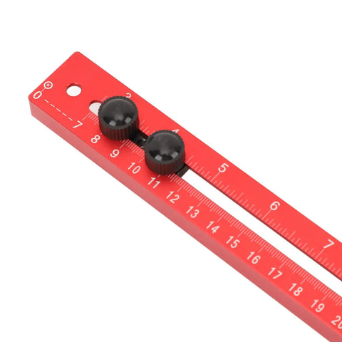 Rock Solid Heavy Duty 4 In 1 Aluminum Router Jig Kit With Quick Assembly Backer Bracket showing a red calibration ruler with knobs.