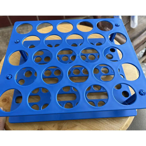 Top view of blue Detachable 50 mL Centrifuge Vial Rack For Lab Use, 25 Well Test Tube Holder, resting on a wooden surface.
