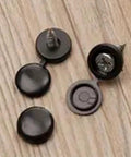 Fifty Pack Plastic Screw Cover Set Delivers Knockout Finish For Furniture And DIY Builds showing black plastic caps on a wooden surface.