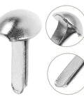 Close-up of silver iron brads from Shadow Puppet Craft Kit With 100 Iron Brads For Puppet Making, Paper Fasteners For Scrapbooking And Do It Yourself Decor.