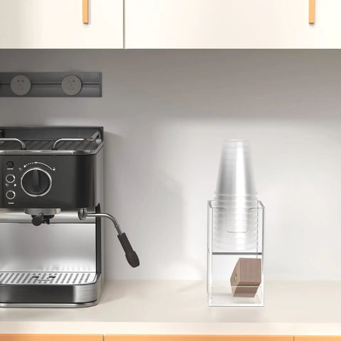 Two Tier Upright Cup And Condiment Organizer With Two Compartment Clear Acrylic Cup Dispenser, Straw Holder And Lid Storage for breakroom coffee station next to espresso machine.