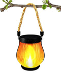 USB Charging Solar Lantern For Outdoors And Travel hanging on a branch, flame effect light, portable solar powered lighting kit