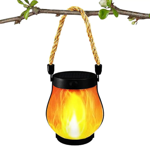 USB Charging Solar Lantern For Outdoors And Travel hanging on a branch, flame effect light, portable solar powered lighting kit