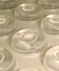 Close-up of Sound Dampening Door Bumpers Half Inch Dia 5mm Height Soft Durometer Two Stage Impact With Clear Adhesive Sheet Of 100