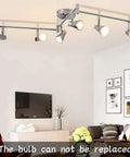 Dope Four Light Track Lighting Kit With Flexible Rotatable Heads And Alabaster Glass Shades in living room setting