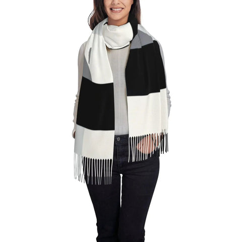 Black And White Piano Grid Winter Scarf Crafted From Plush Faux Cashmere With Extended Fringe Edges worn by woman.