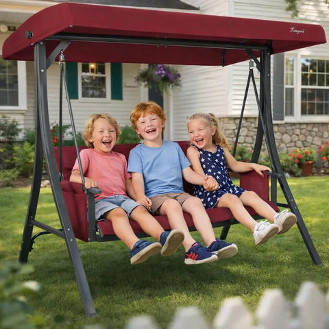 Children enjoying Outdoor Porch Swing Glider With Adjustable Canopy And Weather Resistant Steel Frame in garden on a sunny day
