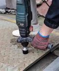 Using vibrating hammer tool for auto body sheet metal bending and repair, panel beating and tile lamination, shop-grade tool in use