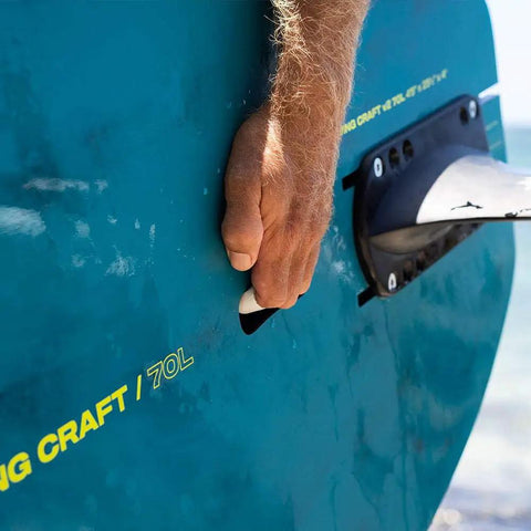 Hand lifting Wing Craft V2 Wingsurf Foil Board 50 L, flat bottom, hard rails, stability in focus, ideal for intermediate to advanced riders.