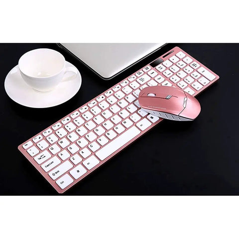 Top Tier Wireless Mechanical Gaming Keyboard Featuring Quiet Mute Switch Laser Etched Markings And Extended Battery Life For Rapid Typing And All Day Play next to a cup and laptop.