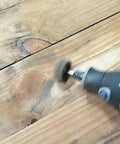 Rotary tool in use with 48 Piece Rotary Tool Buffing Wheel Set With Three Thirty Second Inch Mandrels And 2.35 Mm Shanks, abrasive pad