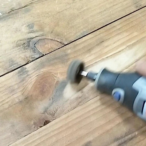 Rotary tool in use with 48 Piece Rotary Tool Buffing Wheel Set With Three Thirty Second Inch Mandrels And 2.35 Mm Shanks, abrasive pad