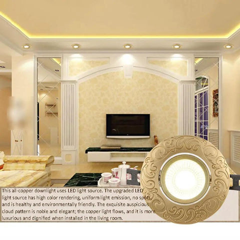 Sleek Four Inch Led Recessed Downlight With Dimmable Spotlight And Flip Switch Tunable Brass Housing ceiling fixture in warm living room.