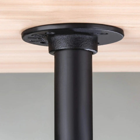 Close-up of single leg from 4 Pack Industrial Pipe Table Leg Set For DIY Rustic Farmhouse Tables And Furniture, attached to wood surface.