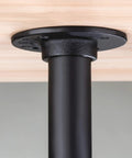 Black flange of Industrial Pipe Table Legs Four Pack For Custom Rustic Tables And Furniture Heavy Duty Farmhouse Iron Desk Legs 30 Inches With Flanges And Shelf Support Diy Ready attached to wooden surface.