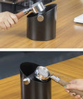 Sleek Matte Black Espresso Knock Box Featuring An Oblique Mouth And Heavy Duty Rubber Lever Stands As A Dope Under Counter Grounds Catch Tamping Station used for coffee pucks.
