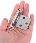 Close-up of a single silver hinge from Set Of Four Spring Loaded Cabinet Hinges Self Closing Heavy Duty Iron Hardware.