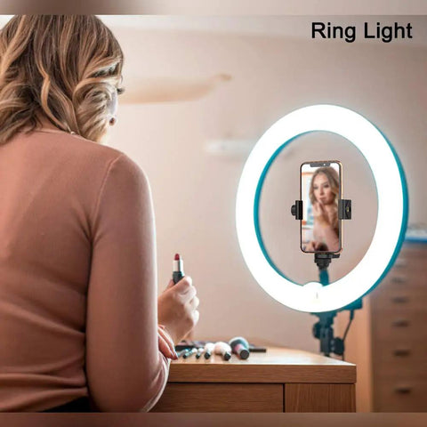 Woman using a ring light with a phone tripod mount with wireless remote and adjustable clamp, 360 degree rotating holder.