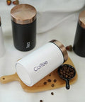 Solid Hella Airtight Metal Coffee Canister Set Keeps Your Beans Fresh And Tastes Dope With Wide Mouth Design For Snagging Tea Sugar And Daily Pantry Essentials on wooden board.