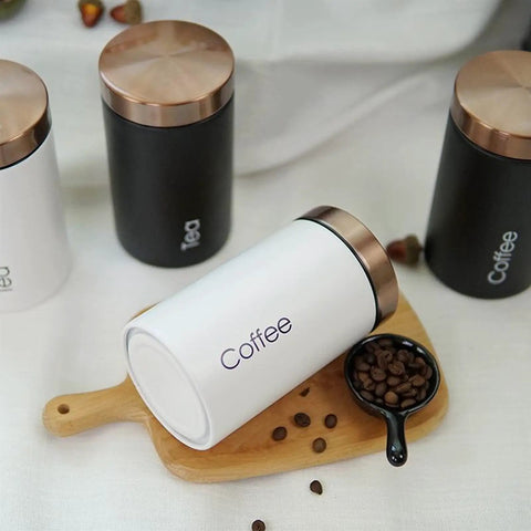 Solid Hella Airtight Metal Coffee Canister Set Keeps Your Beans Fresh And Tastes Dope With Wide Mouth Design For Snagging Tea Sugar And Daily Pantry Essentials on wooden board.