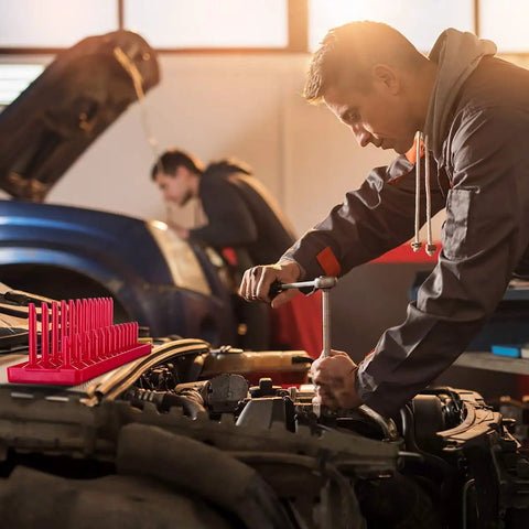 Mechanic using tools with Six Piece Socket Organizer Tray Set For One Quarter Three Eighths And One Half Inch Drives visible