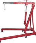 Top Shelf Folding Hydraulic Engine Hoist With Telescopic Boom 2 Ton Capacity Muscle Power Motor Crane For Tough Garage Builds And No Sweat Auto Repairs Road Warrior Shop Rig, red steel structure with hydraulic lift.