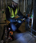 Electrician using Digital Clamp Meter With Autorange TRMS For Electricians, Measures AC Current, AC And DC Voltage on a circuit.