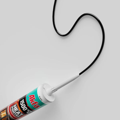 Heat Fighter Black Fireplace Sealant cartridge with nozzle, designed for sealing high-temperature joints up to 2700°F.